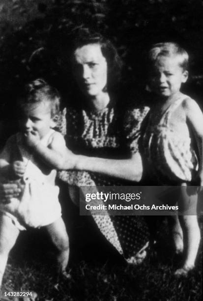 March 1948: Six month old Arnold Schwarzenegger in the garden with his mother Aurelia and half brother Meinhard in March 1948 in Thal, Austria.