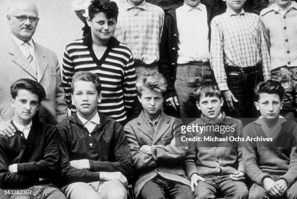 Eleven year old Arnold Schwarzenegger poses for a photo with his classmates in 1958 in Thal, Austria.