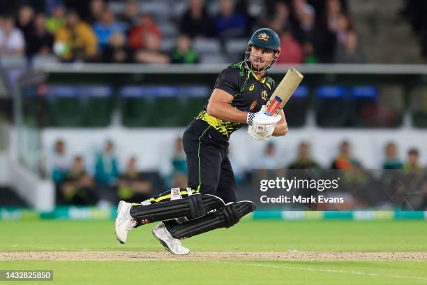 Marcus Stoinis of Australia bats during game two of the T20 International series between Australia and England at Manuka Oval on October 12, 2022 in...