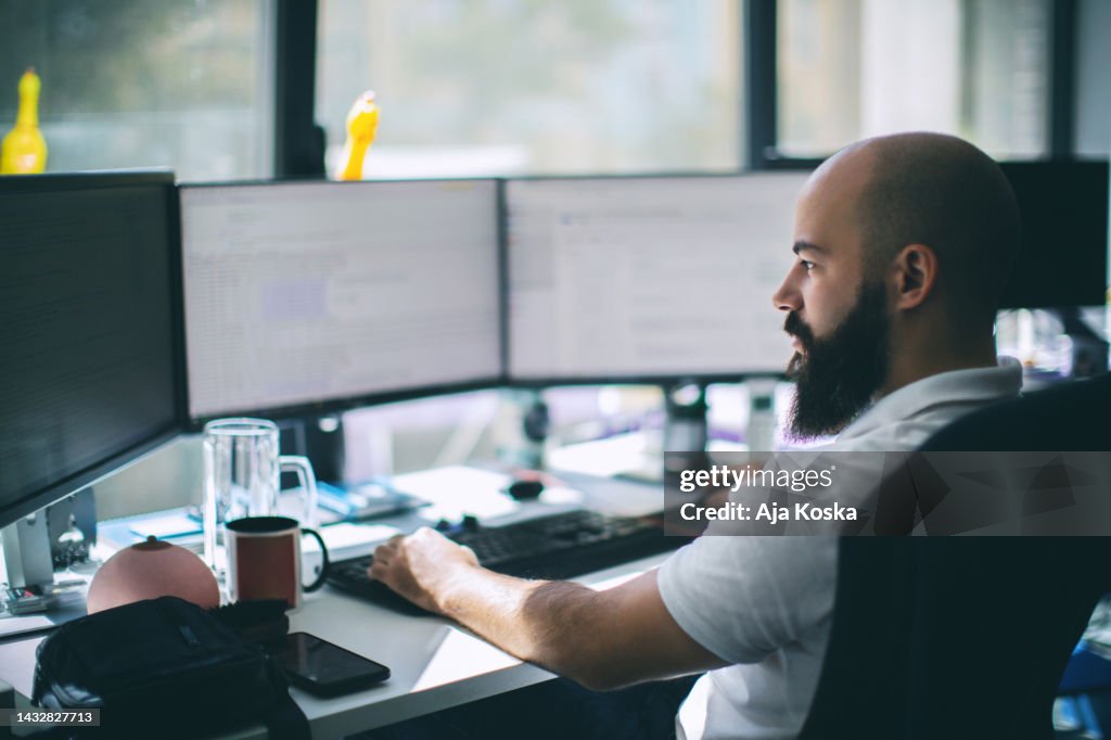 Computer programmer working on new software program.