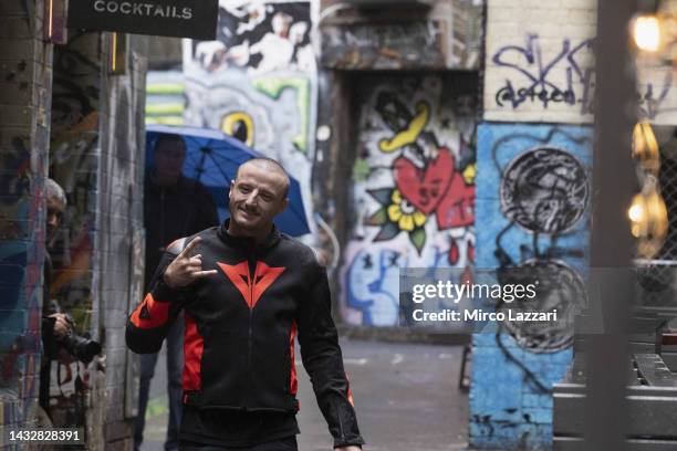 Jack Miller of Australia and Ducati Lenovo Team greets and walks along Duckboard Place to ACDC Lane during the 2022 MotoGP of Australia Preview Media...