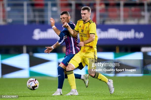 Yanis Rahmani of SD Eibar compete for the ball with Raul Parra of CD Mirandes during the LaLiga Smartbank match between SD Eibar and CD Mirandes at...