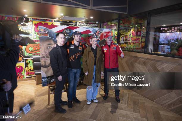 Jack Miller of Australia and Ducati Lenovo Team and Remy Gartner of Australia and Tech3 KTM Factory Racing pose near the artwork by Justine Millsom...