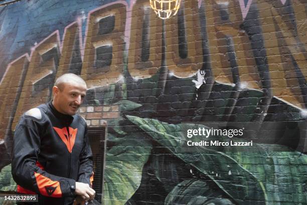 Jack Miller of Australia and Ducati Lenovo Team smiles near murals along Duckboard Place to ACDC Lane during the 2022 MotoGP of Australia Preview...