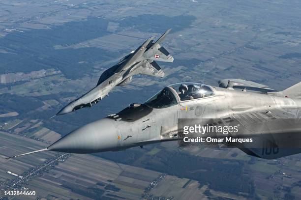 Mikoyan MIG-29 fighter jets of the Polish Air Force take part in a NATO shielding exercise at the Lask Air Base on October 12, 2022 in Lask, Poland....