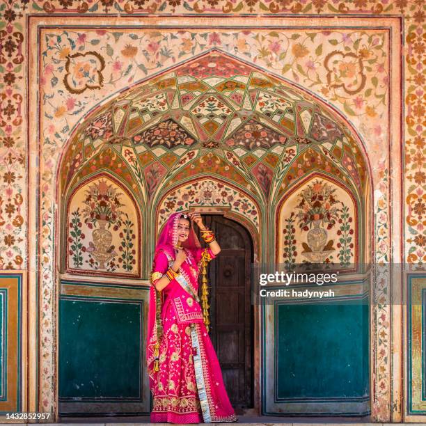 young indian woman on the way to amber fort, india - amer fort stock pictures, royalty-free photos & images