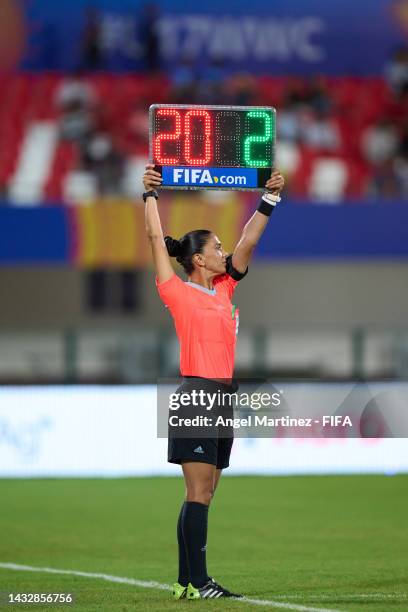 The assistant referee shows the substitute board during the FIFA U-17 Women's World Cup 2022 Group A match between India and USA at Kalinga Stadium...