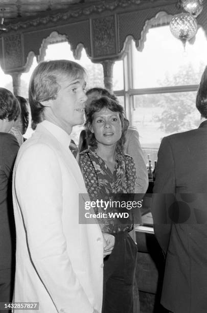 Tennis players John Lloyd and Evonne Googalong attend the Wimbledon luncheon in London, England, on June 22, 1982.