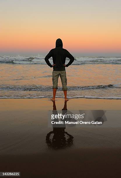 heroe on beach - super heroe stockfoto's en -beelden