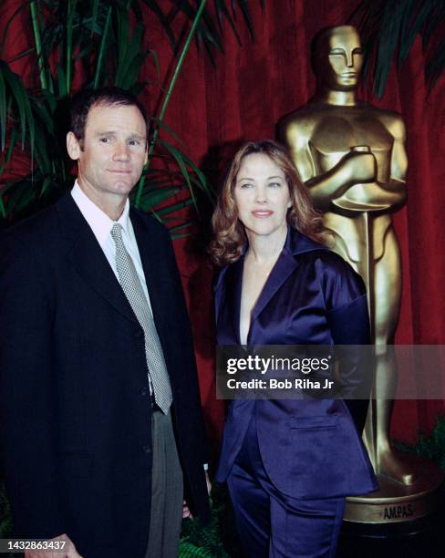 Bo Welch and Catherine O'Hara arrive at the Oscar Luncheon at Beverly Hilton Hotel, March 12, 1997 in Beverly Hills, California.