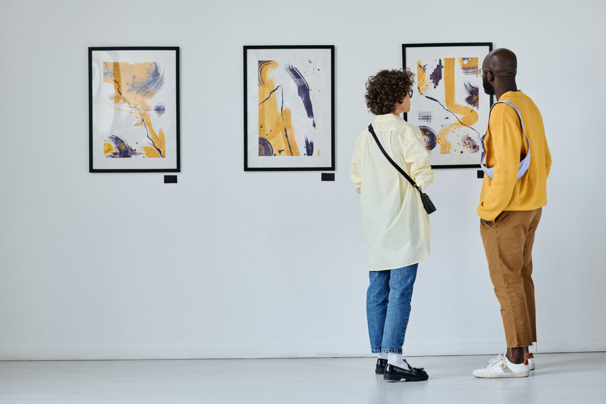 Young couple visiting art gallery Young couple visiting art gallery