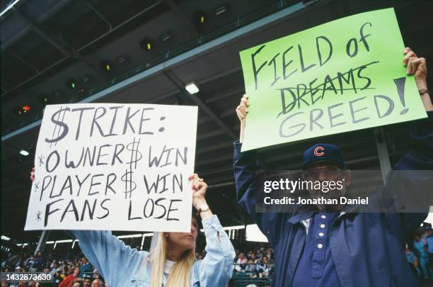 General view of baseball fans of the Chicago Cubs holding up signs protesting against the proposed strike by the Major League Baseball Players...