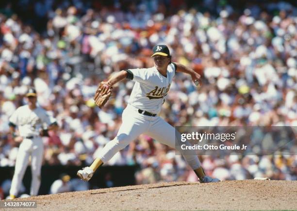Rick Honeycutt, Left handed Pitcher for the Oakland Athletics winds up to throw a pitch during the Major League Baseball American League West game...