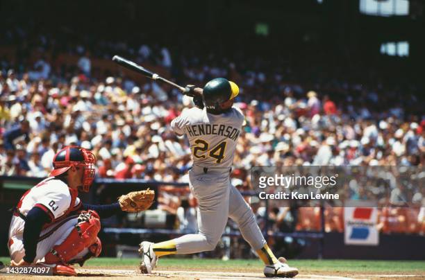 Rickey Henderson, Left Field for the Oakland Athletics swings at a pitch during the Major League Baseball American League West game against the...