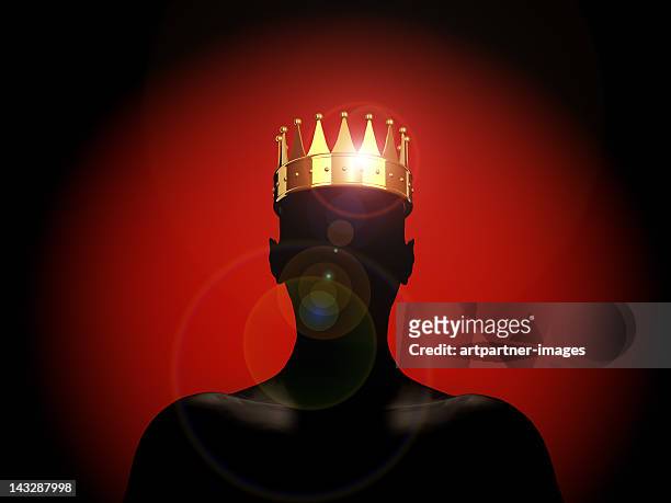 golden crown on a male silhouette - the king - king royal person stock-fotos und bilder