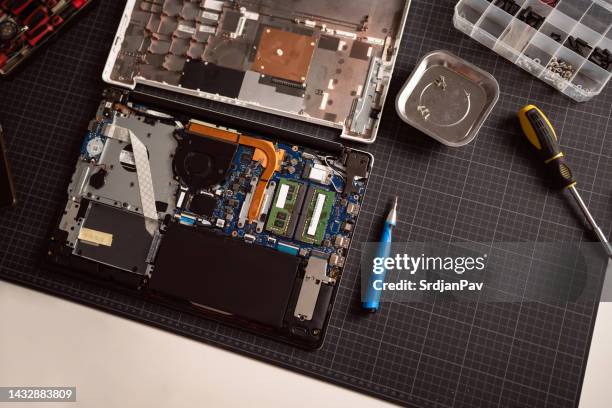 high angle view of disassembled laptop on the desk - disassembled stock pictures, royalty-free photos & images