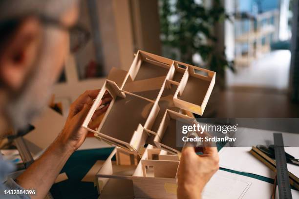 unrecognizable architect observing architectural model he making - pen mockup stock pictures, royalty-free photos & images