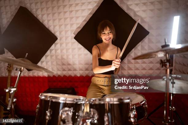 caucasian female drummer, playing drums at the recording studio - drummer 個照片及圖片檔