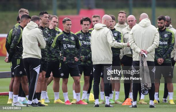 Manager Erik ten Hag of Manchester United talks to the squad during a first team training session at Carrington Training Ground on October 12, 2022...