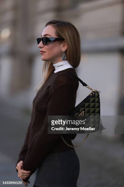 Sonia Lyson is seen wearing brown Prada sunglasses, a total Prada look and a Prada Triangle Symbole bag, on October 07, 2022 in Berlin, Germany.