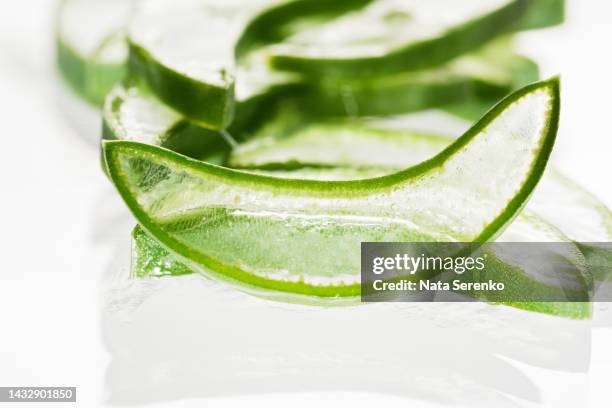 aloe vera slice texture background. medicinal plant macro. - aloe slices stock pictures, royalty-free photos & images