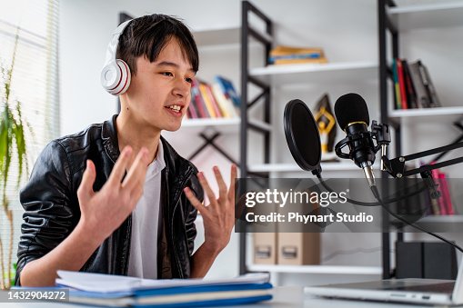 Teenager boy recording podcast at home Teenager boy recording podcast at home