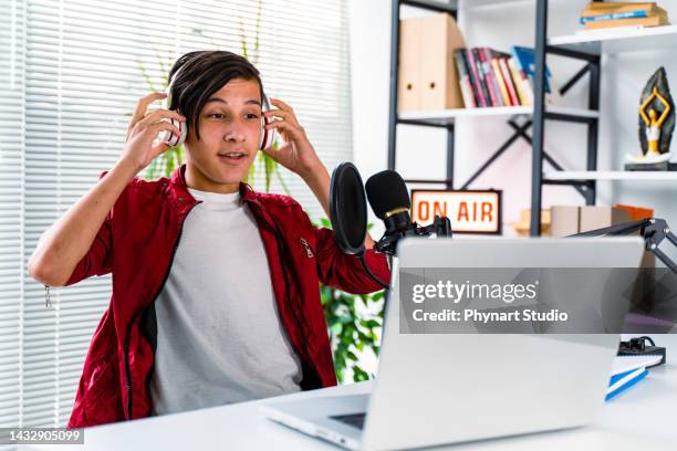 teenager boy recording podcast at home - radio broadcasting stock pictures, royalty-free photos & images