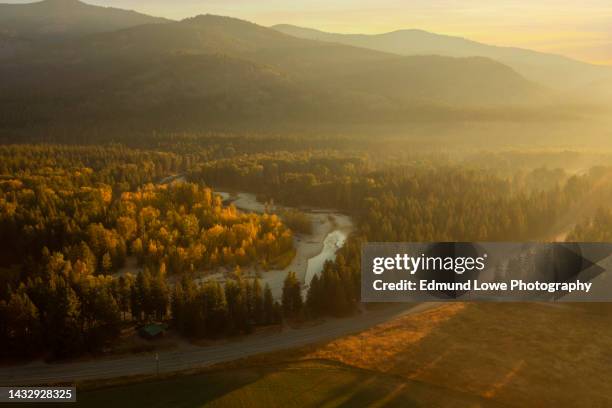misty fall morning over the methow river near mazama, washington. - methow valley stock pictures, royalty-free photos & images