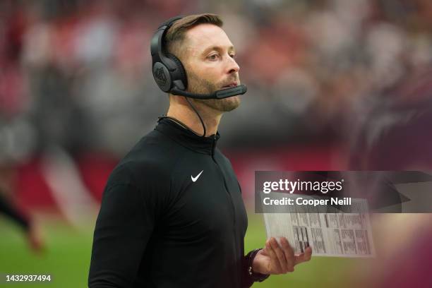 Head coach Kliff Kingsbury of the Arizona Cardinals looks down field against the Philadelphia Eagles at State Farm Stadium on October 9, 2022 in...