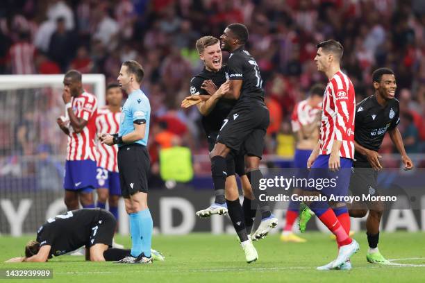 Bjorn Meijer and Clinton Mata of Club Brugge celebrate following the UEFA Champions League group B match between Atletico Madrid and Club Brugge KV...