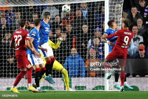 Roberto Firmino of Liverpool scores their team's first goal during the UEFA Champions League group A match between Rangers FC and Liverpool FC at...