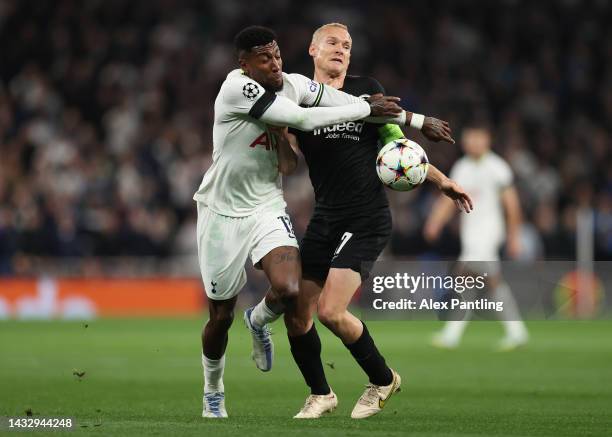 Emerson of Tottenham Hotspur battles for possession with Sebastian Rode of Eintracht Frankfurt during the UEFA Champions League group D match between...