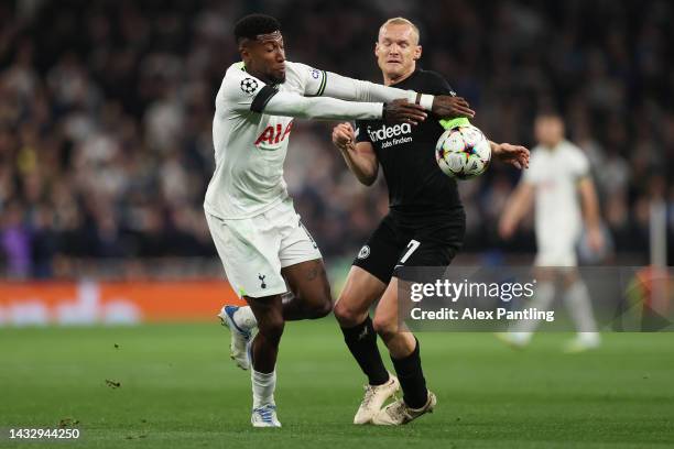 Emerson of Tottenham Hotspur battles for possession with Sebastian Rode of Eintracht Frankfurt during the UEFA Champions League group D match between...