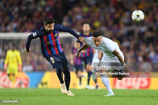 Gerard Pique of FC Barcelona battles for possession with Lautaro Martinez of FC Internazionale during the UEFA Champions League group C match between...