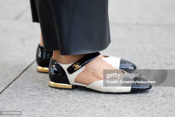 Tamara von Nayhauss wearing flat beige, black and gold shoes by Chanel during a street style shoot on August 31, 2022 in Berlin, Germany.