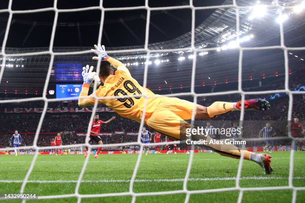 Diogo Costa of FC Porto saves a penalty kick from Kerem Demirbay of Bayer Leverkusen during the UEFA Champions League group B match between Bayer 04...