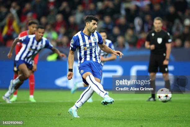 Mehdi Taremi of FC Porto scores their team's second goal from the penalty spot during the UEFA Champions League group B match between Bayer 04...