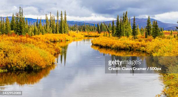 scenic view of lake against sky during autumn,alaska,united states,usa - farben stock pictures, royalty-free photos & images