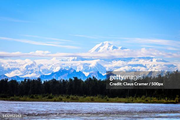 scenic view of lake by snowcapped mountains against sky,talkeetna,alaska,united states,usa - talkeetna stock pictures, royalty-free photos & images