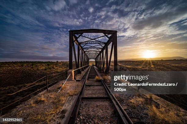 high angle view of railroad tracks against sky during sunset,guadix,granada,spain - ponte ferroviária imagens e fotografias de stock