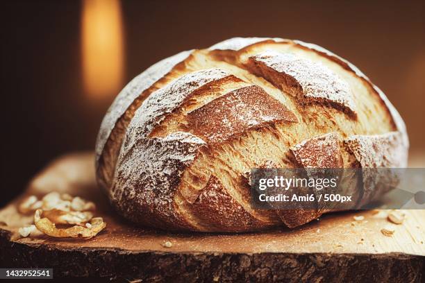 close-up of bread on table - loaf of bread ストックフォトと画像