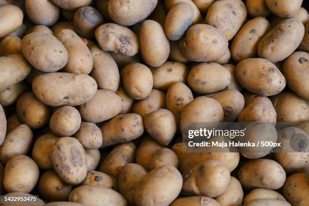 full frame shot of potatoes for sale at market stall - raw potato stock pictures, royalty-free photos & images