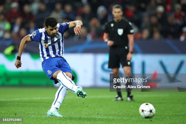 Mehdi Taremi of FC Porto scores their team's third goal from the penalty spot during the UEFA Champions League group B match between Bayer 04...