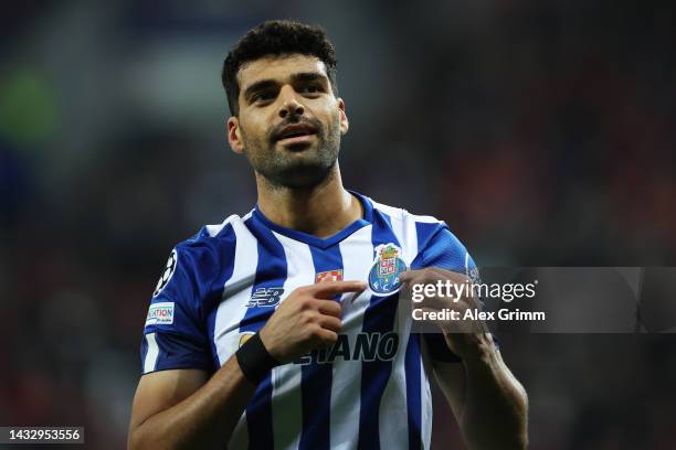 Mehdi Taremi of FC Porto celebrates after scoring their team's third goal from the penalty spot during the UEFA Champions League group B match...