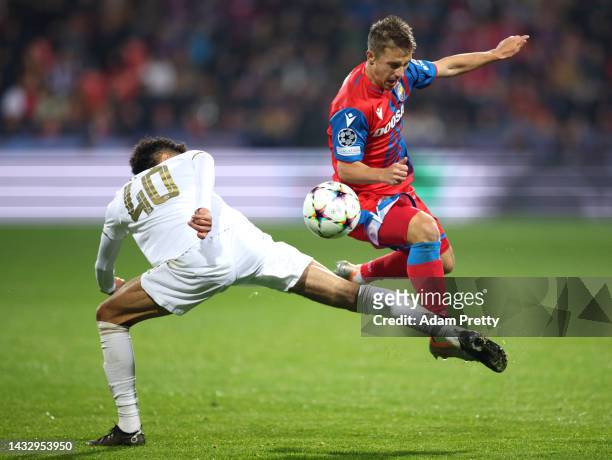 Adam Vlkanova of Viktoria Plzen battles for possession with Noussair Mazraoui of Bayern Munich during the UEFA Champions League group C match between...
