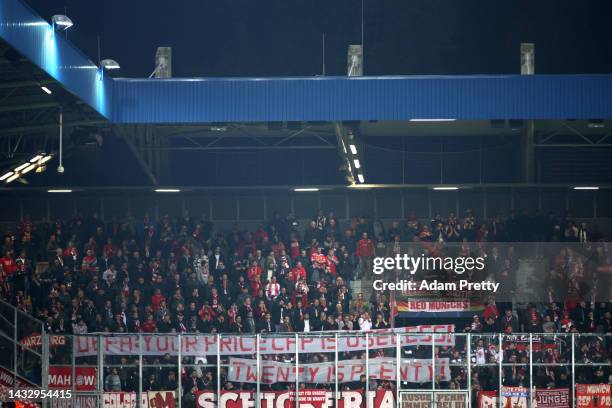 Fans hold up a banner reading "UEFA: Your price cap is useless! Twenty is plenty!" during the UEFA Champions League group C match between Viktoria...