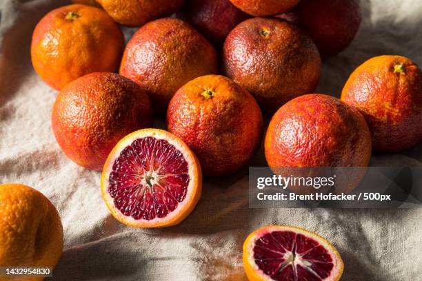 high angle view of grapefruit on table - half complete stock pictures, royalty-free photos & images