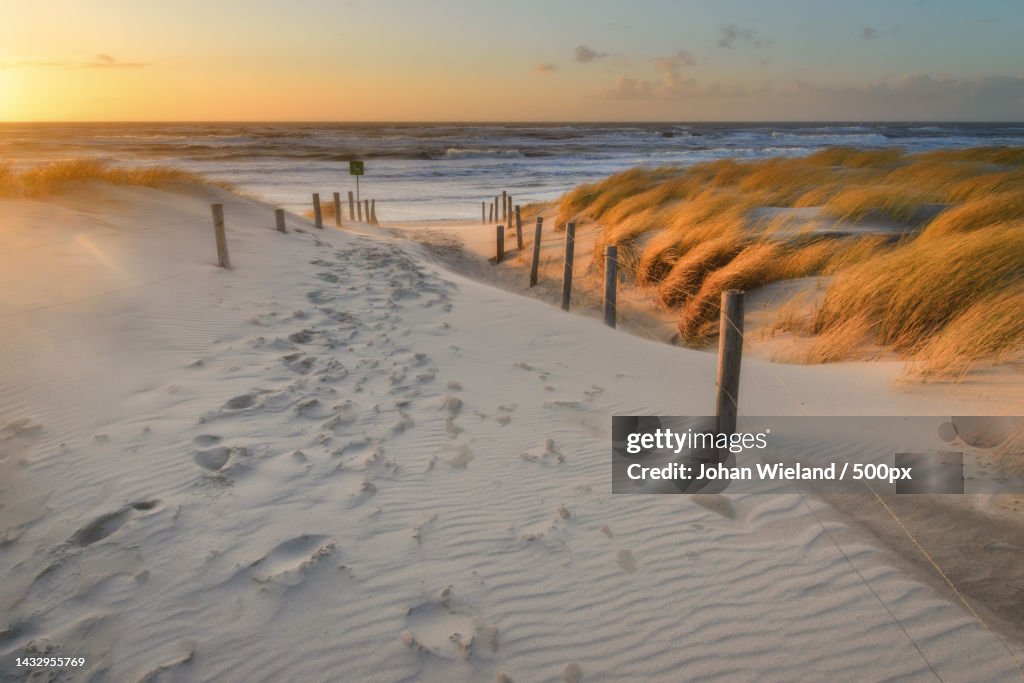 Scenic view of beach against sky during sunset,NJ Petten,Netherlands,Petten