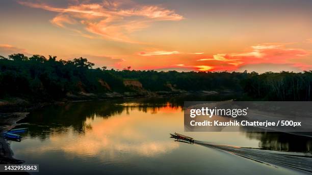 scenic view of lake against sky during sunset,puerto maldonado,peru - paisajes de peru fotografías e imágenes de stock