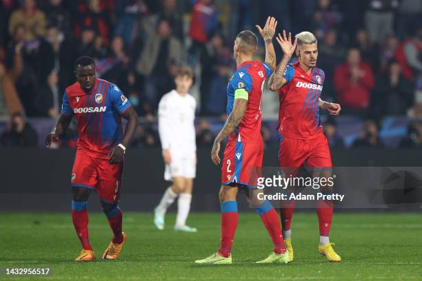Jan Kliment of Viktoria Plzen celebrates with teammate Lukas Hejda after scoring their team's second goal during the UEFA Champions League group C...